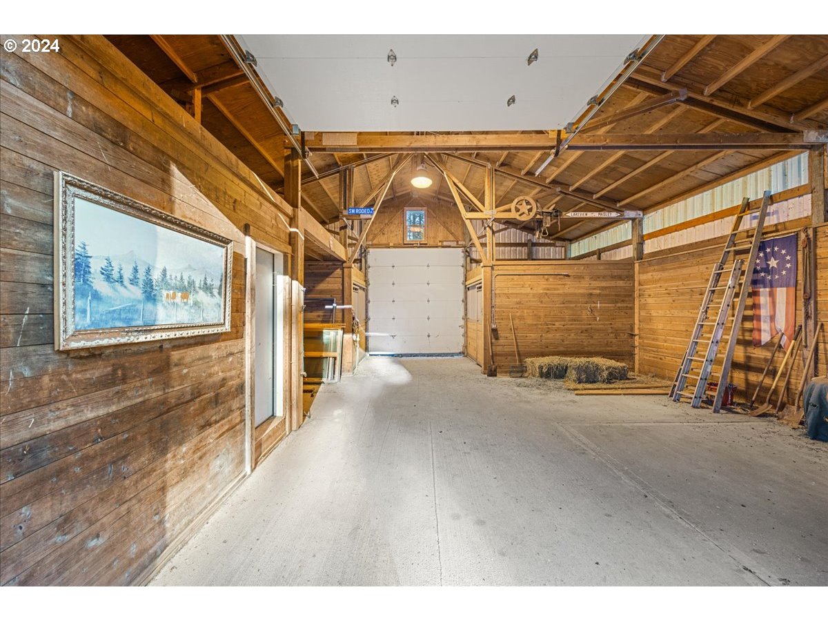 18650 South Lyons Road Oregon City, OR 97045 - Photo 39 of 47 a view of a room with wooden walls