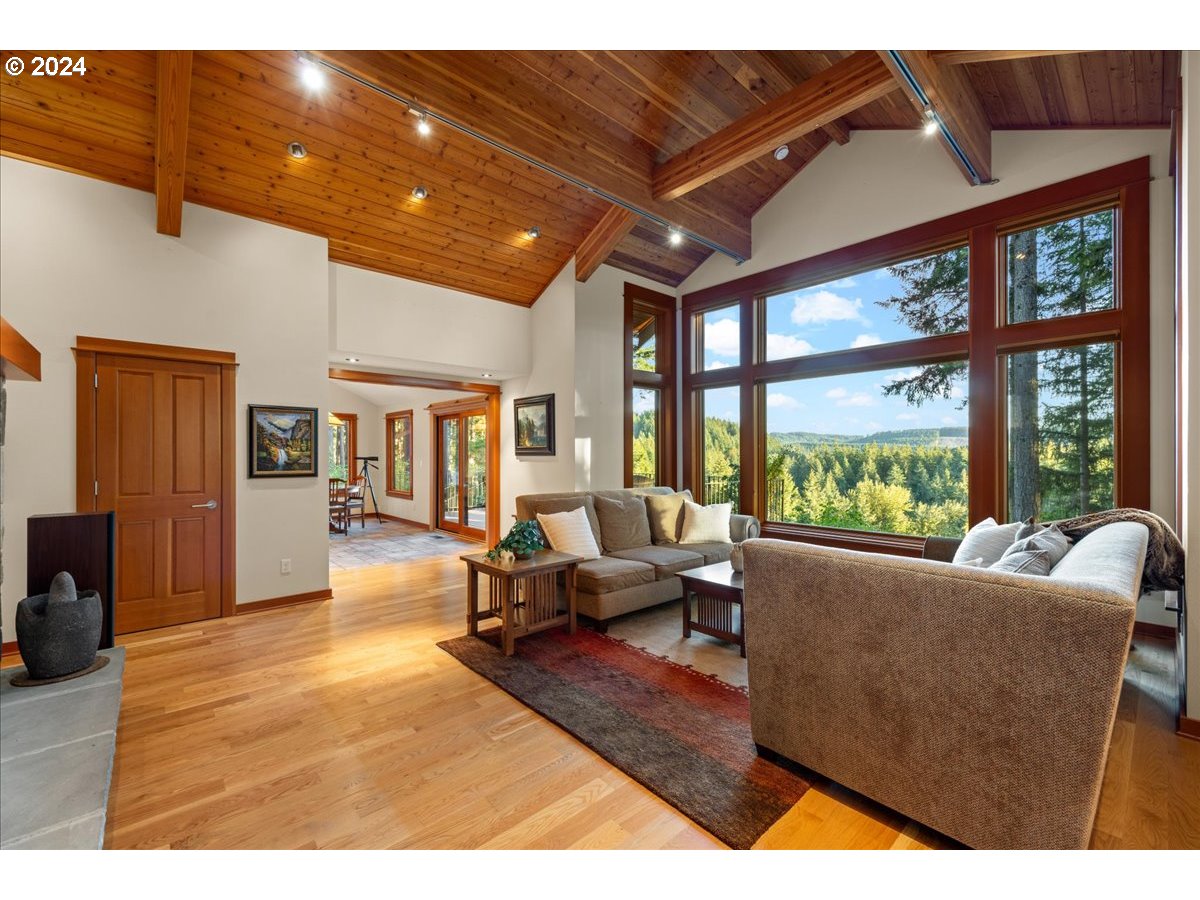 18650 South Lyons Road Oregon City, OR 97045 - Photo 10 of 47 a living room with furniture and large windows