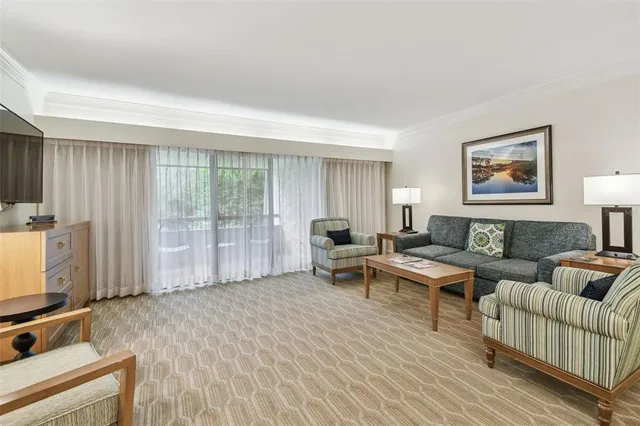 a living room with furniture and a table