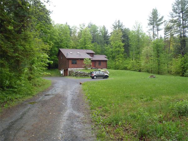 65 Amherst Road Leverett, MA 01054 - Photo 1 of 1 a front view of a house with garden
