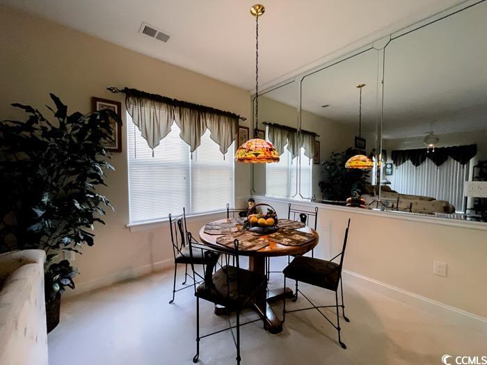 1101 Peace Pipe Place, Unit 104 Myrtle Beach, SC 29579 - Photo 14 of 22 Dining space featuring baseboards