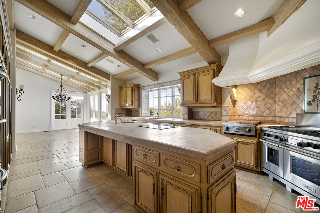 74 Saddleback Road Rolling Hills, CA 90274 - Photo 11 of 65 a kitchen with a stove and a sink