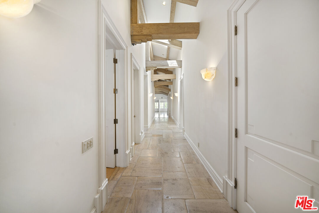 74 Saddleback Road Rolling Hills, CA 90274 - Photo 26 of 65 a view of a hallway with wooden floor and staircase