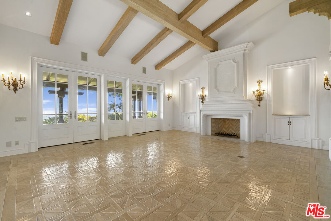 74 Saddleback Road Rolling Hills, CA 90274 - Photo 31 of 65 a view of empty room with floor to ceiling window and fireplace