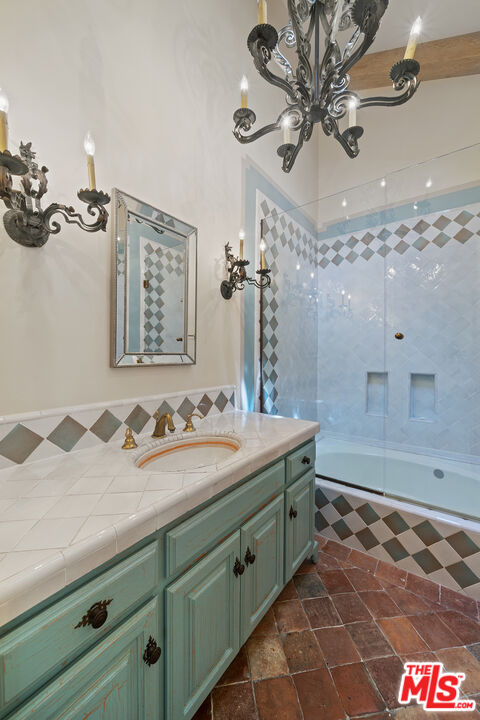 74 Saddleback Road Rolling Hills, CA 90274 - Photo 34 of 65 a bathroom with a sink and a mirror