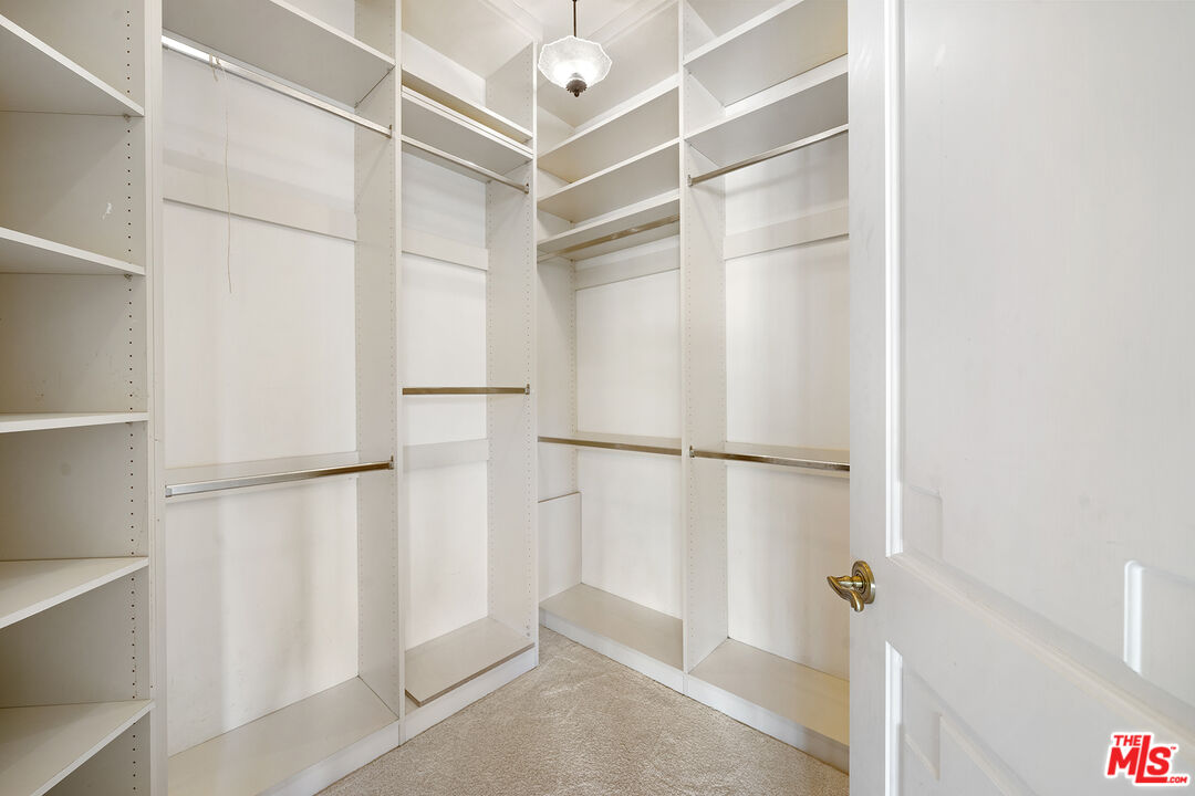 74 Saddleback Road Rolling Hills, CA 90274 - Photo 37 of 65 a view of walk in closet with empty racks