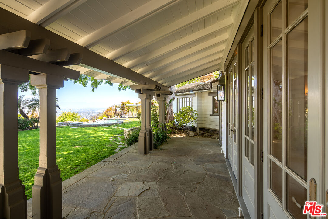 74 Saddleback Road Rolling Hills, CA 90274 - Photo 49 of 65 a view of a porch with chairs and backyard