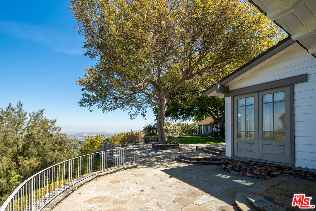 74 Saddleback Road Rolling Hills, CA 90274 - Photo 50 of 65 a view of a street with a house in the background