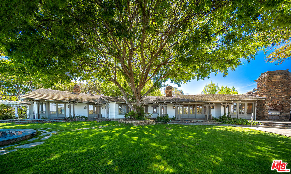 74 Saddleback Road Rolling Hills, CA 90274 - Photo 55 of 65 a view of a front of a house with a yard
