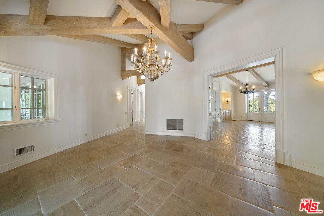 74 Saddleback Road Rolling Hills, CA 90274 - Photo 7 of 65 a view of an empty room with a chandelier