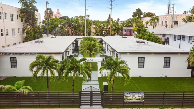 a view of a white building and outdoor space