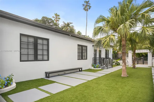 a front view of a house with garden