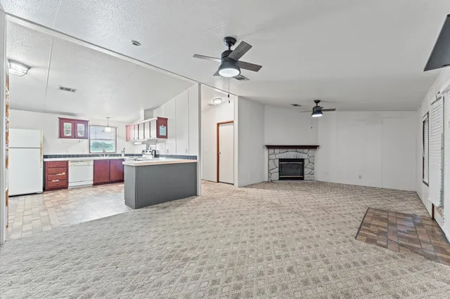 a view of a kitchen with a sink cabinets and window