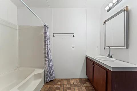 a bathroom with a sink and a mirror
