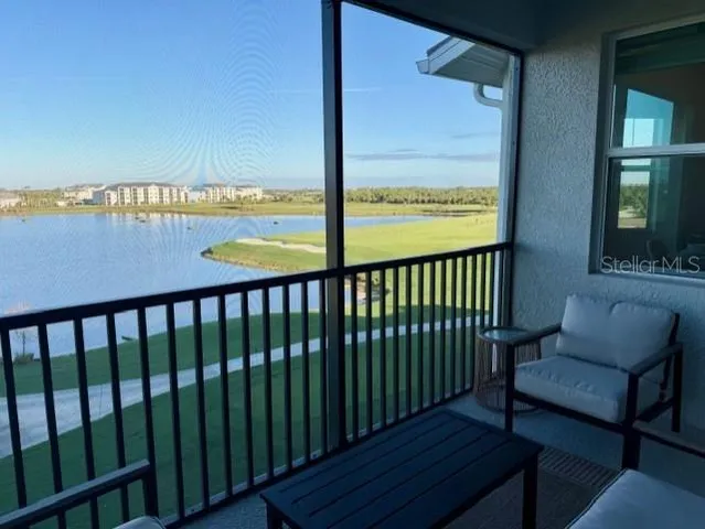 a view of a balcony with furniture