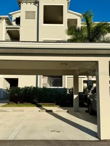 a view of front door and potted plants