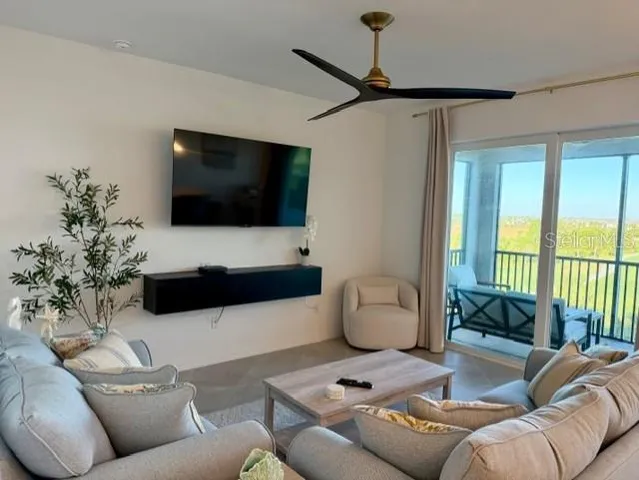 a living room with furniture and a flat screen tv
