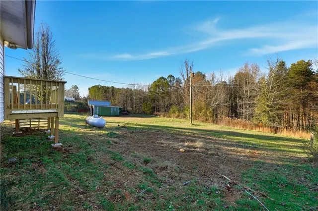 a view of a swimming pool with an outdoor space and seating area