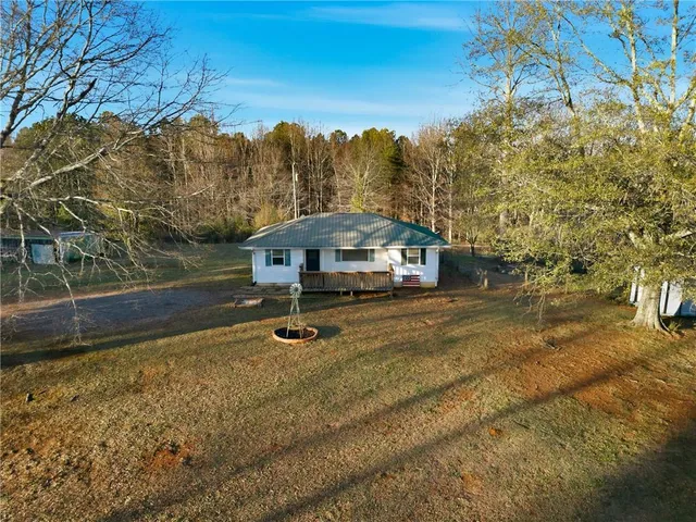 a view of a tree with a yard