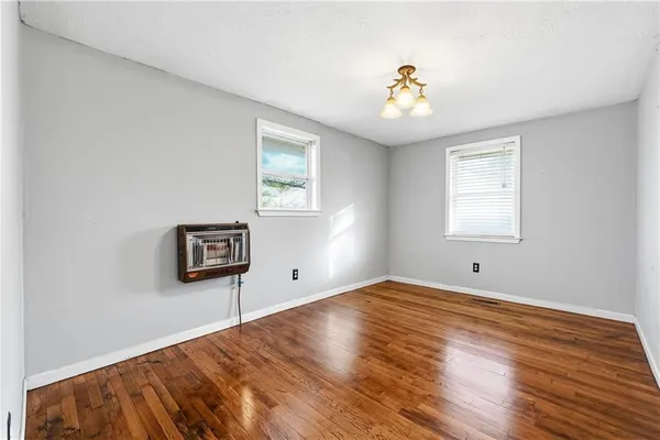 a kitchen with stainless steel appliances granite countertop a stove microwave and sink