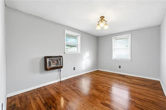 a kitchen with stainless steel appliances granite countertop a stove microwave and sink