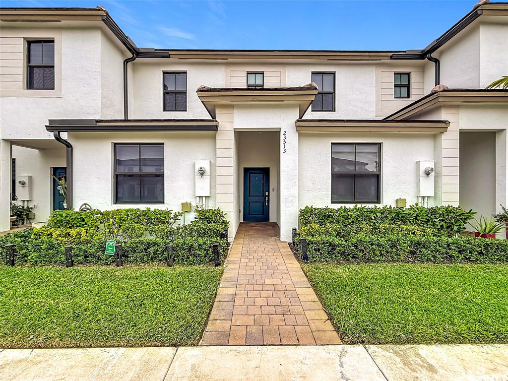 front view of a house with a yard