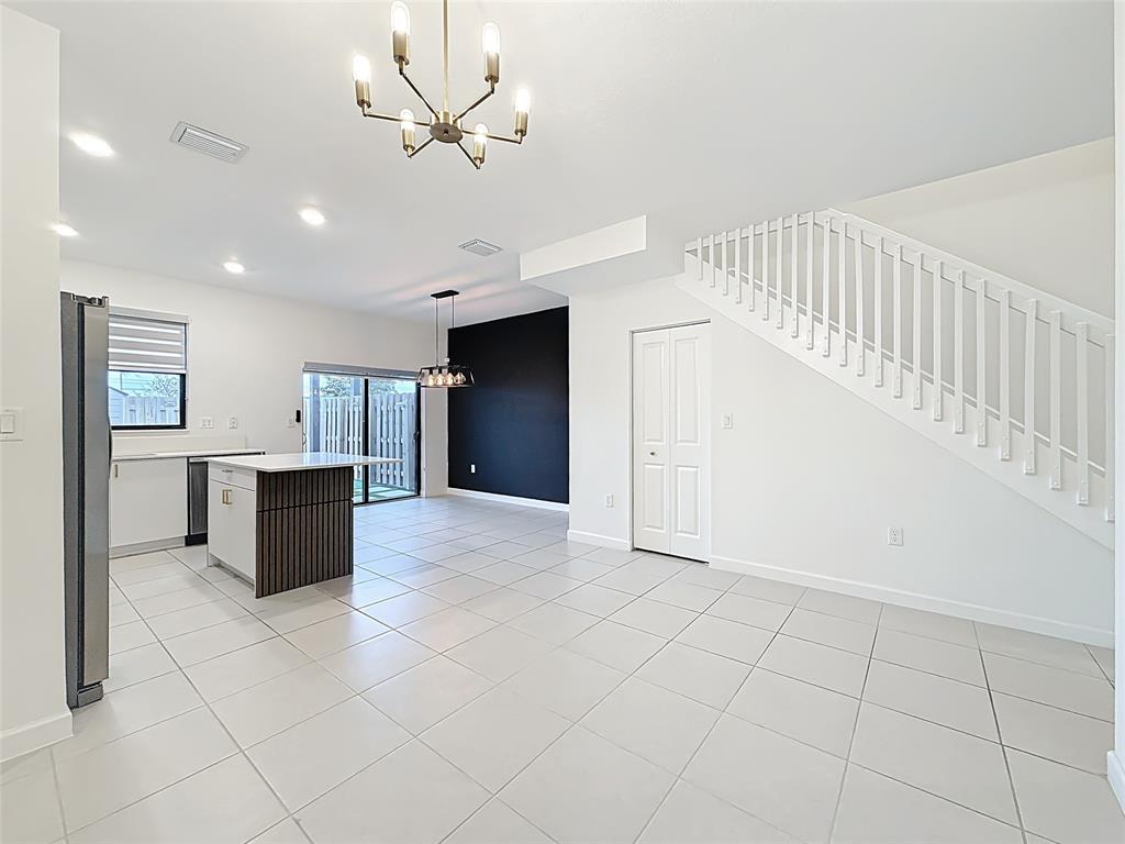 23513 Southwest 127th Place Homestead, FL 33032 - Photo 13 of 43 a view of kitchen with windows and refrigerator