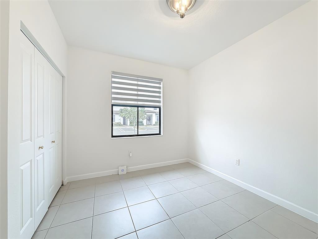 23513 Southwest 127th Place Homestead, FL 33032 - Photo 21 of 43 an empty room with windows