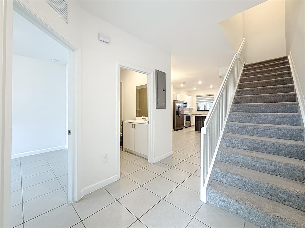 23513 Southwest 127th Place Homestead, FL 33032 - Photo 25 of 43 a view of entryway and hall with wooden floor