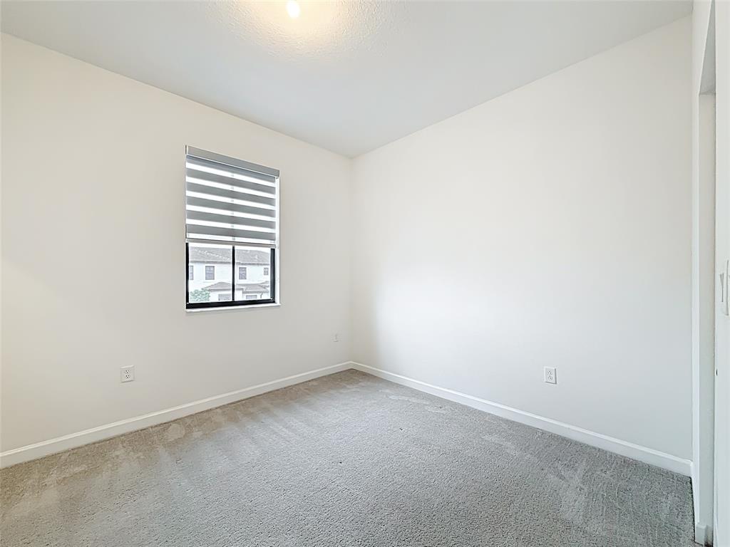 23513 Southwest 127th Place Homestead, FL 33032 - Photo 27 of 43 an empty room with windows