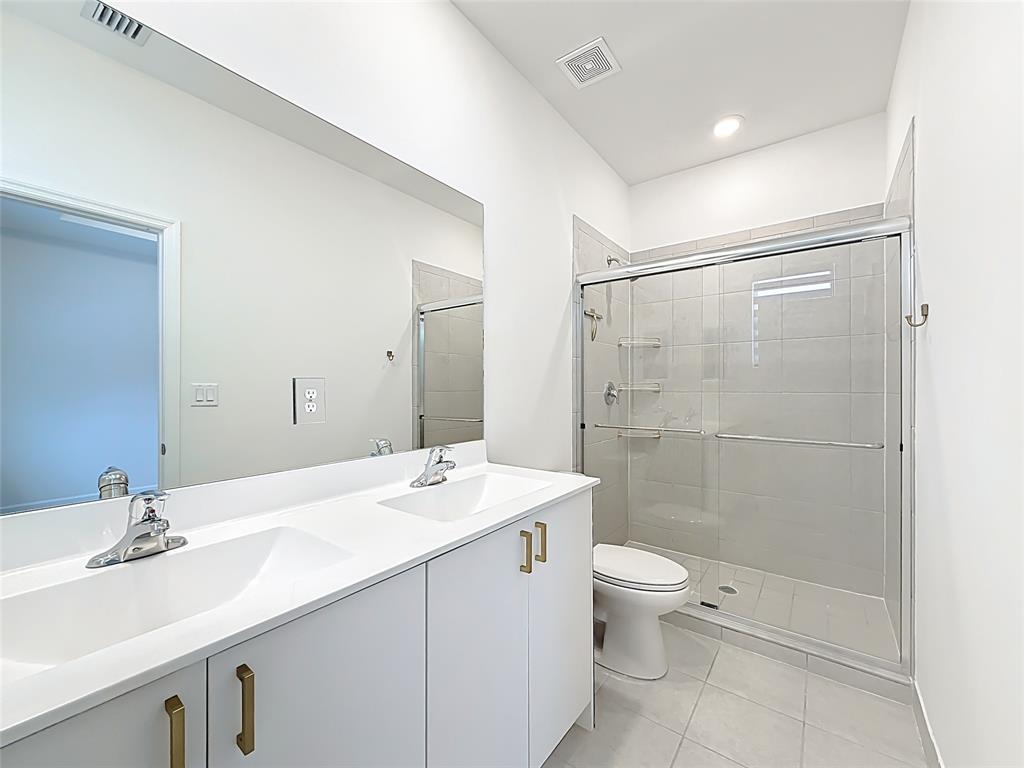 23513 Southwest 127th Place Homestead, FL 33032 - Photo 34 of 43 a bathroom with a sink a toilet and shower