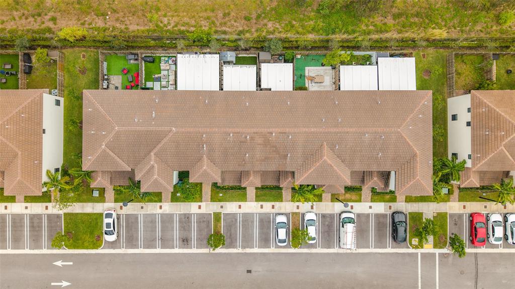 23513 Southwest 127th Place Homestead, FL 33032 - Photo 39 of 43 a view of building with an outdoor space and seating