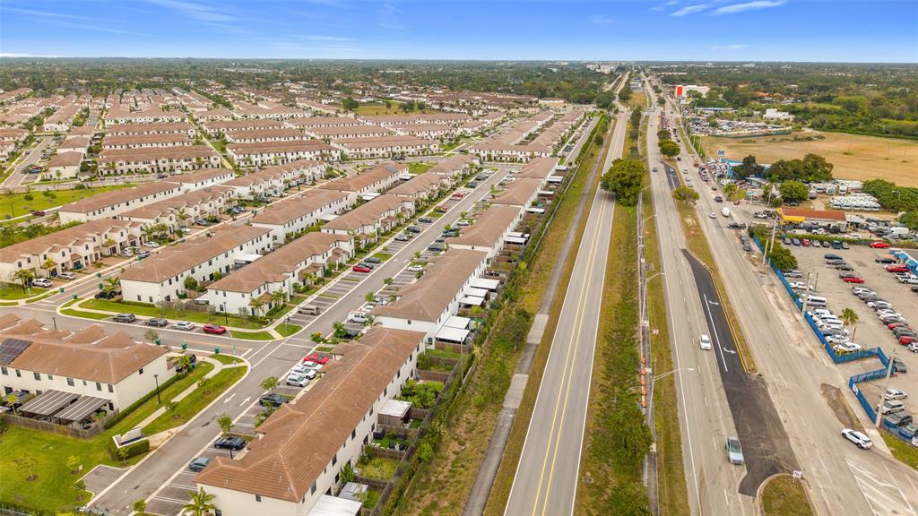 23513 Southwest 127th Place Homestead, FL 33032 - Photo 41 of 43 an aerial view of residential building and lake