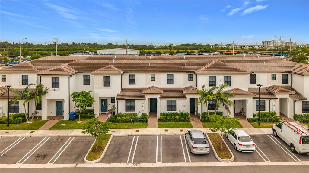 23513 Southwest 127th Place Homestead, FL 33032 - Photo 5 of 43 front view of a building with a garden