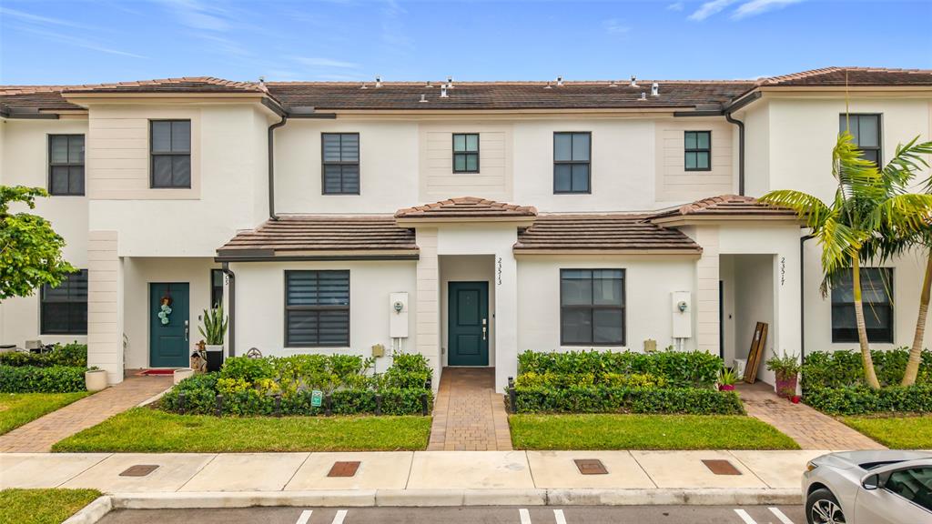 23513 Southwest 127th Place Homestead, FL 33032 - Photo 7 of 43 a view of house with a yard and potted plants