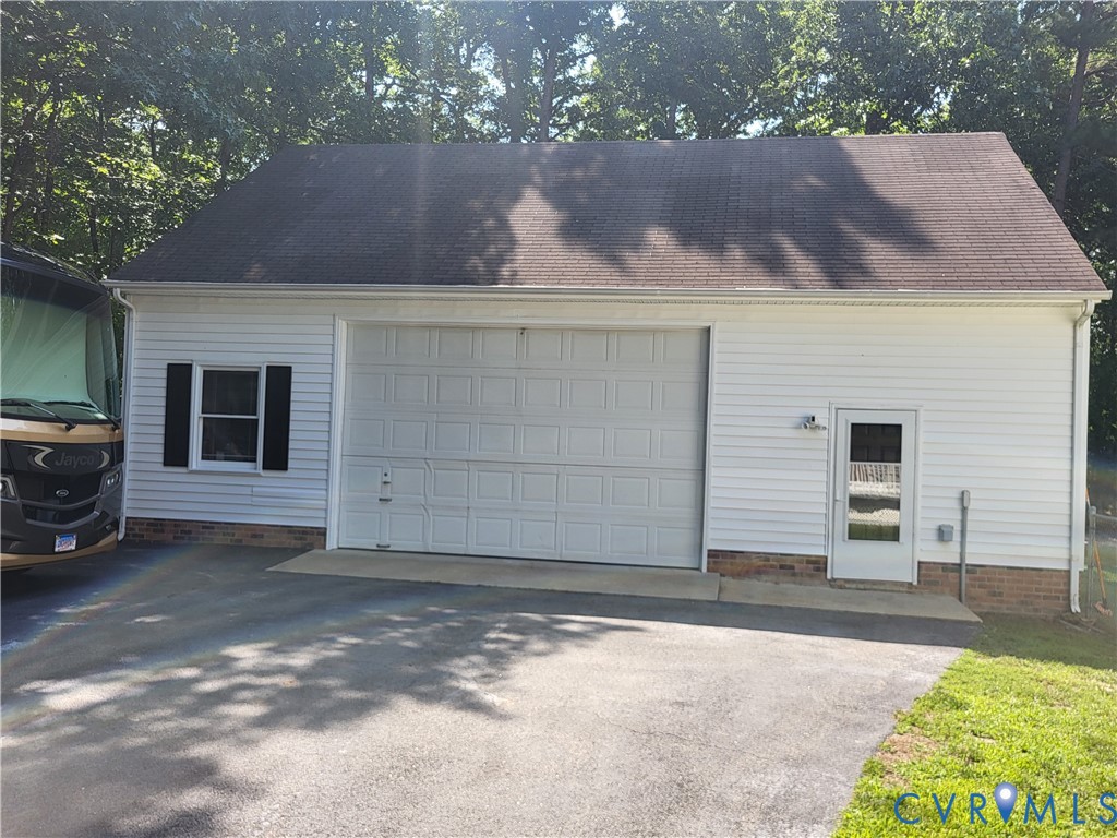 13521 Bailey Bridge Road Midlothian, VA 23112 - Photo 4 of 9 Detached garage featuring white vinyl siding, a pa