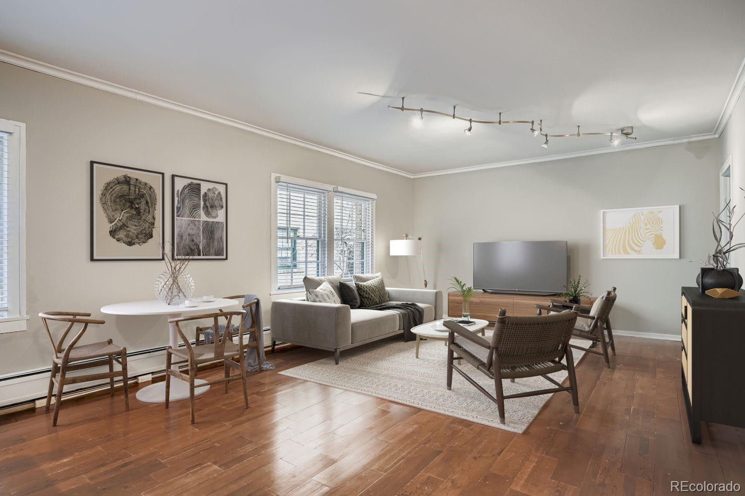 960 Sherman Street, Unit 1B Denver, CO 80203 - Photo 11 of 25 a living room with furniture and a wooden floor
