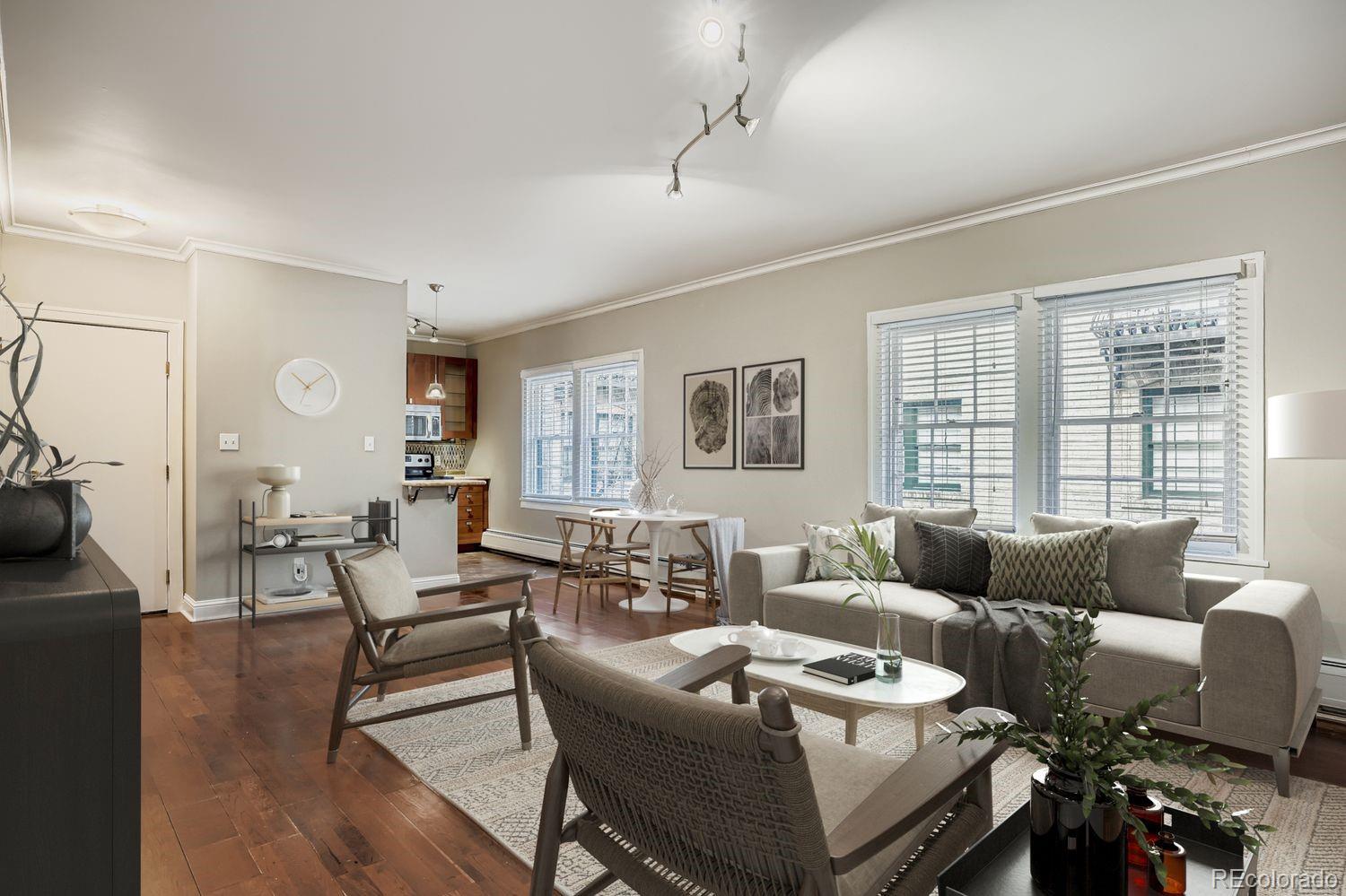 960 Sherman Street, Unit 1B Denver, CO 80203 - Photo 9 of 25 a living room with furniture and a window