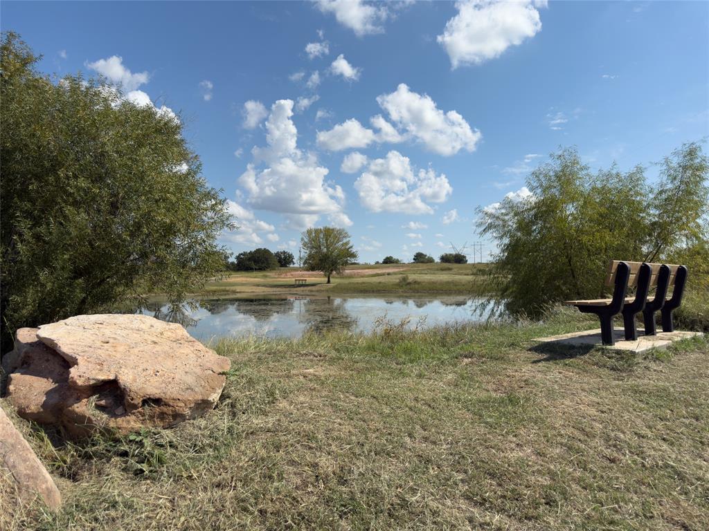 330 Rolling Rnch Boulevard Alvord, TX 76225 - Photo 17 of 21 a view of a lake in between two of trees
