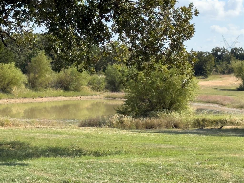 330 Rolling Rnch Boulevard Alvord, TX 76225 - Photo 18 of 21 a view of a lake with a yard