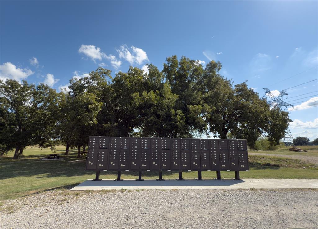 330 Rolling Rnch Boulevard Alvord, TX 76225 - Photo 20 of 21 a view of street with a bench and trees
