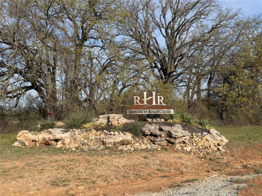 330 Rolling Rnch Boulevard Alvord, TX 76225 - Photo 21 of 21 a view of a wooden fence with a tree