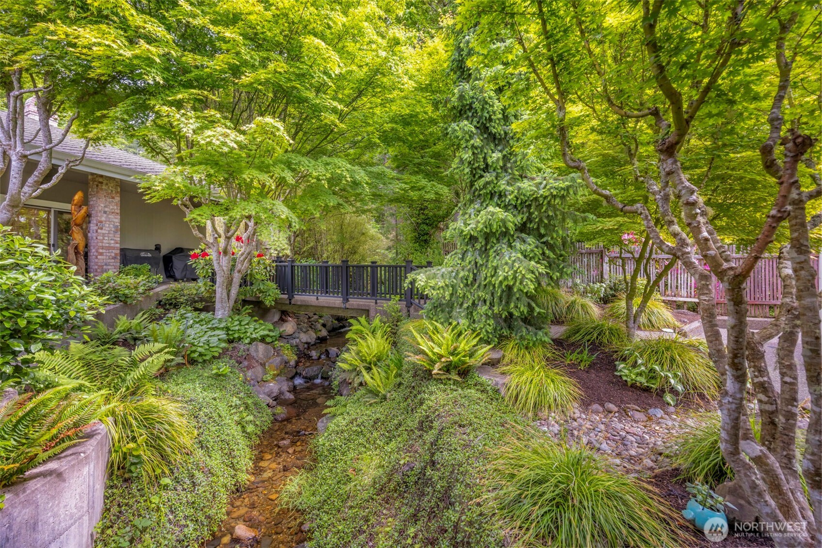 6591 Northeast North Shore Road Belfair, WA 98528 - Photo 8 of 37 a backyard of a house with lots of green space