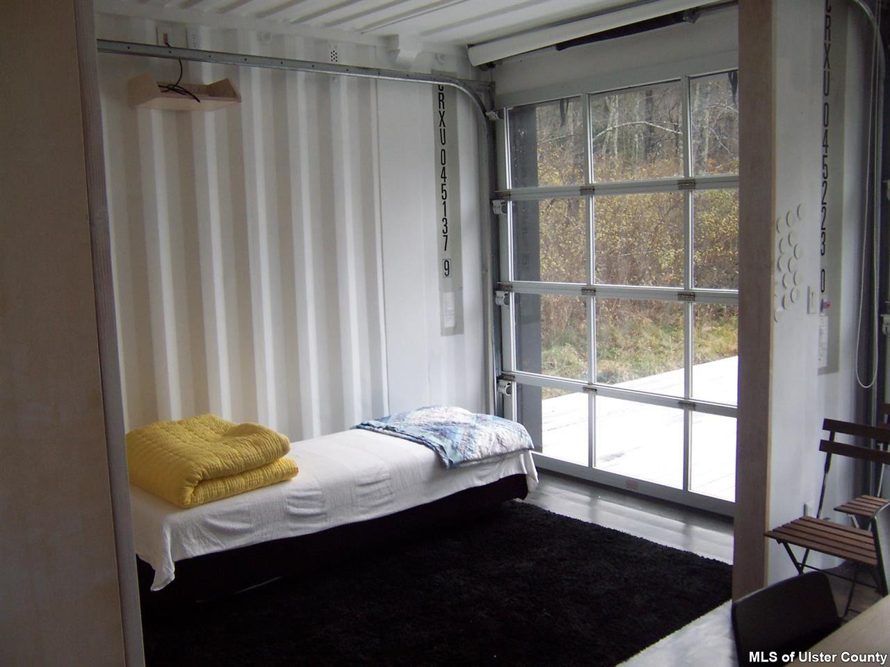4896 Vega Mountain Road Roxbury, NY 12474 - Photo 8 of 14 a bedroom with a bed and a window