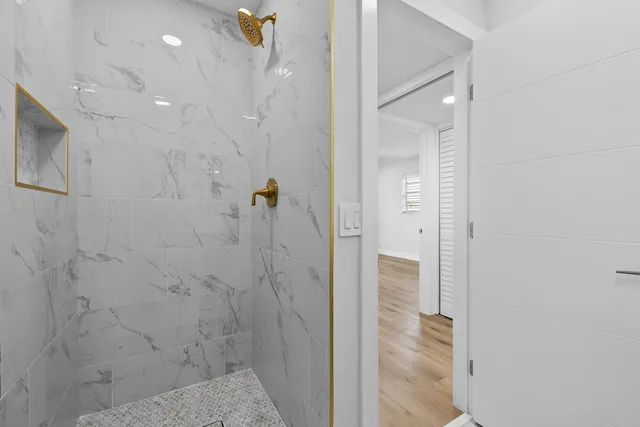 a bedroom with a bed potted plant and a window