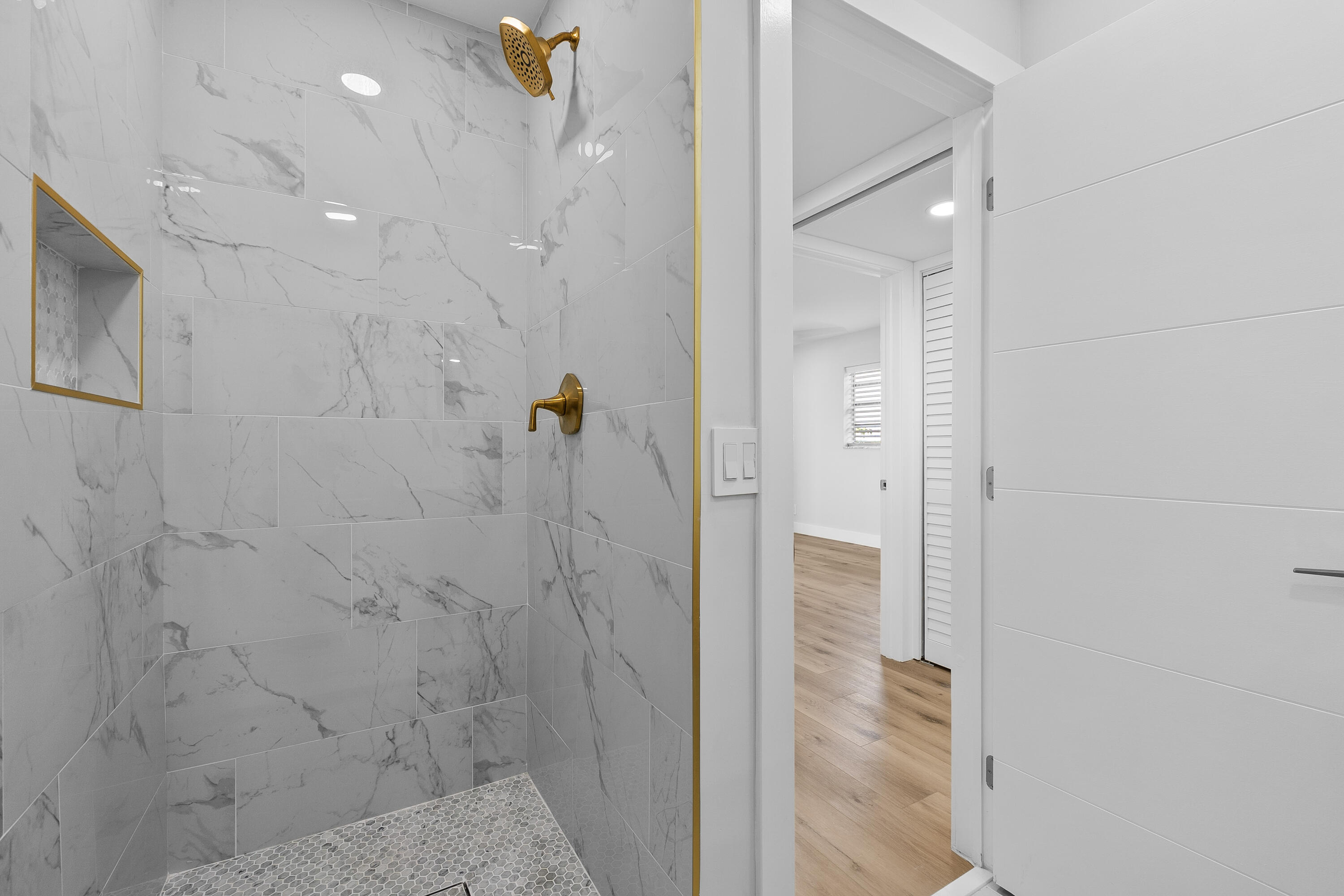 314 Monaco Boulevard, Unit G Delray Beach, FL 33446 - Photo 14 of 26 a bathroom with a shower