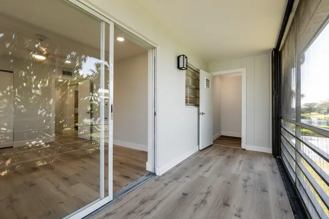 a view of a street with cars parked