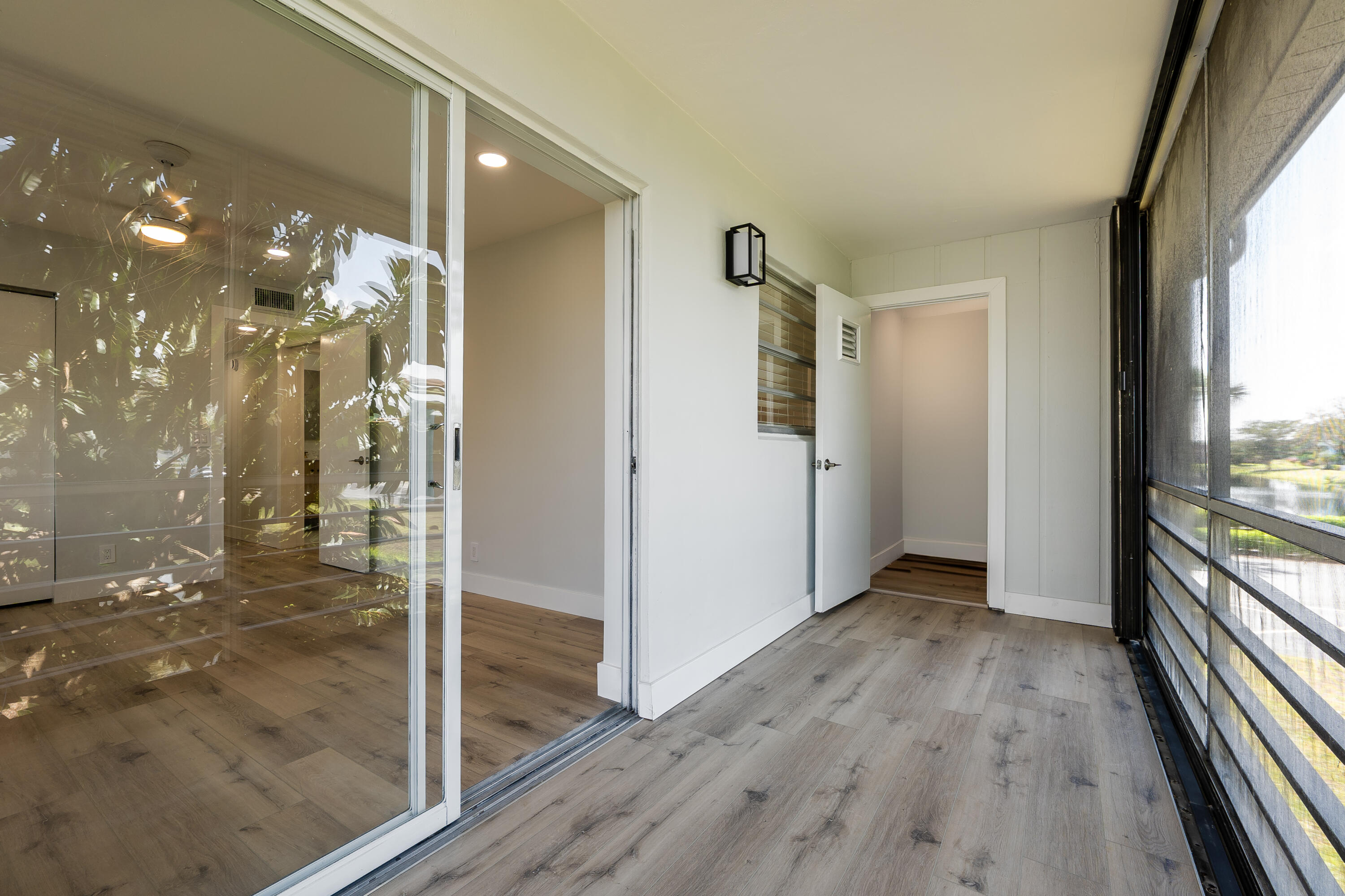 314 Monaco Boulevard, Unit G Delray Beach, FL 33446 - Photo 23 of 26 a view of hallway with wooden floor