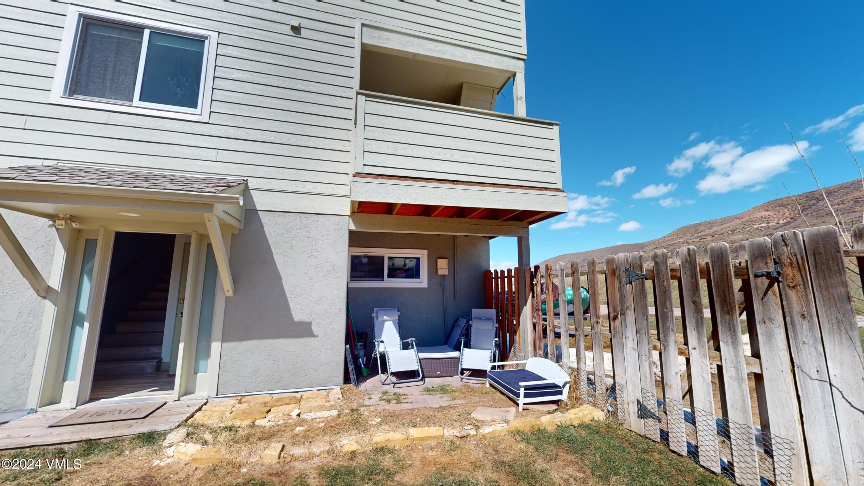 314 Eagle Road, Unit B1 Avon, CO 81620 - Photo 16 of 24 a view of a chair and tables in patio
