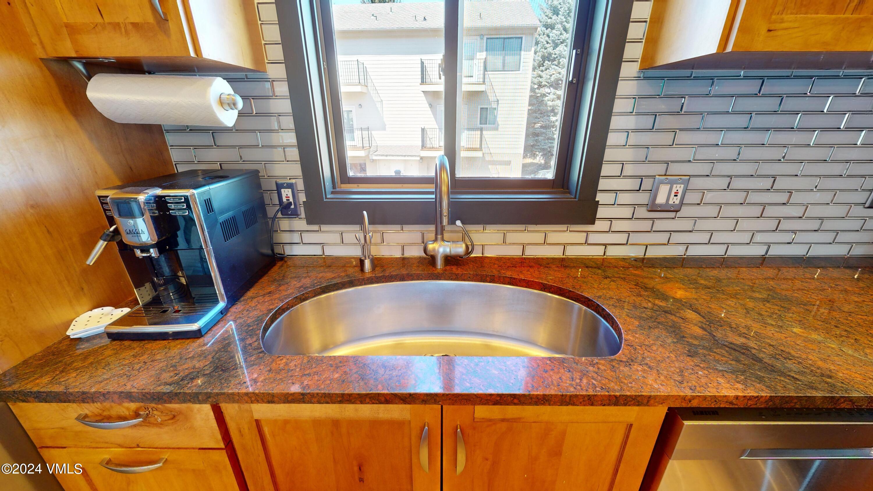 314 Eagle Road, Unit B1 Avon, CO 81620 - Photo 5 of 24 a bathroom with a granite countertop sink and a mirror